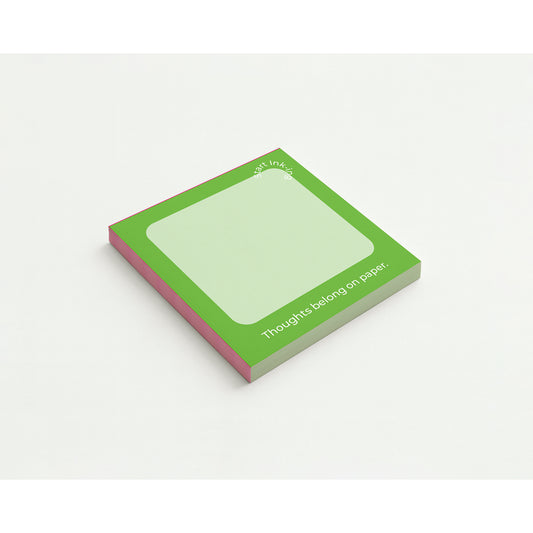 A green notepad with a clean white space for writing.
