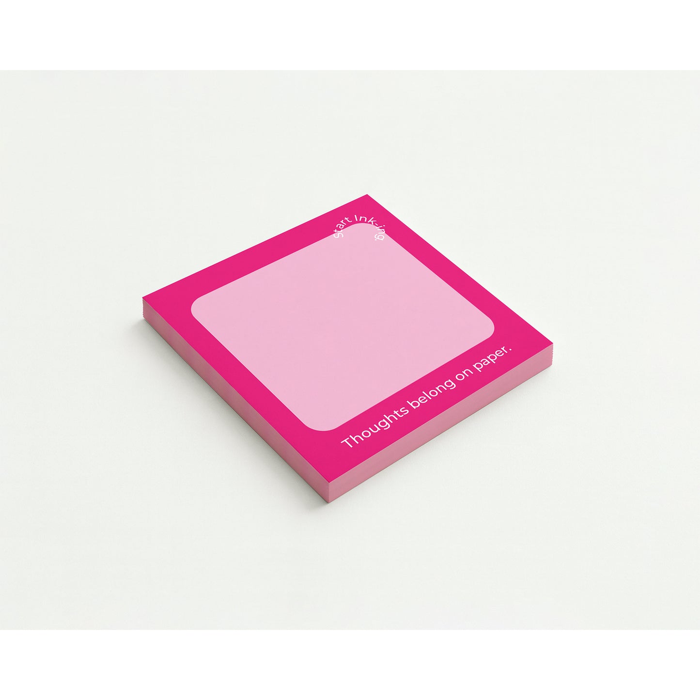 A pink notepad with a clean white space for writing.