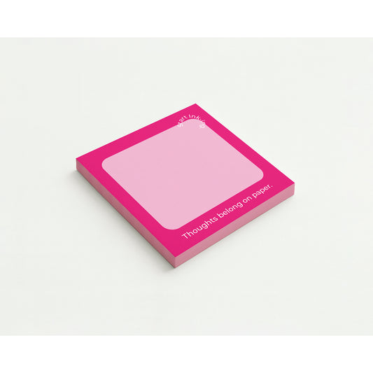 A pink notepad with a clean white space for writing.