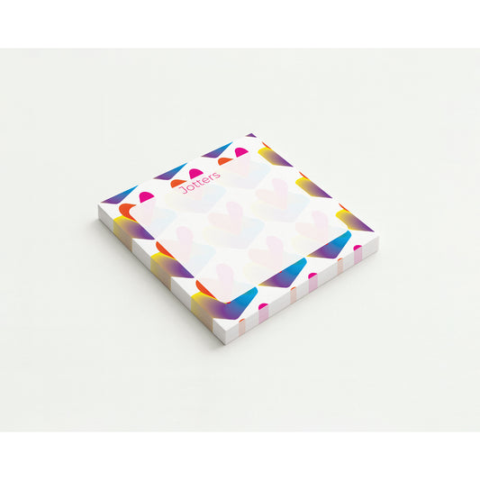Colorful geometric patterned notepad on a white background