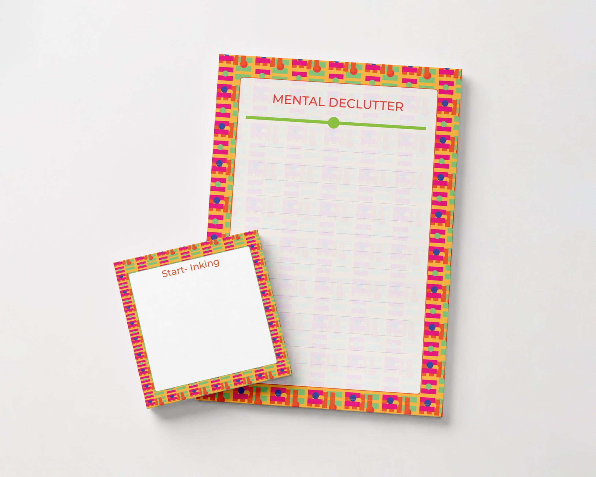 A notepad set with a colorful patterned border on a light gray background. The larger pad is titled 'MENTAL DECLUTTER' with a lined writing area, and the smaller matching pad in front is labeled 'Start: inking'.