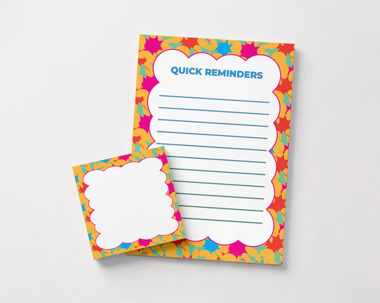 Bright floral "Quick Reminders" notepad and matching sticky notes featuring colorful pink, orange, yellow, and blue patterned borders for organizing daily tasks and reminders.